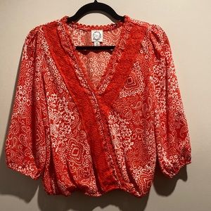 Francesca’s red top